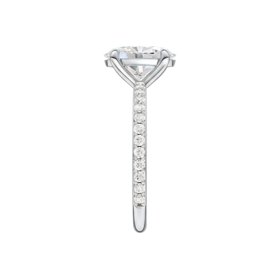 A side view of the Oval cut diamond engagement ring in 14k white gold with a prong diamond band and cathedral setting