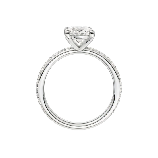 A profile view of the Oval cut diamond engagement ring in 14k white gold with a prong diamond band and cathedral setting