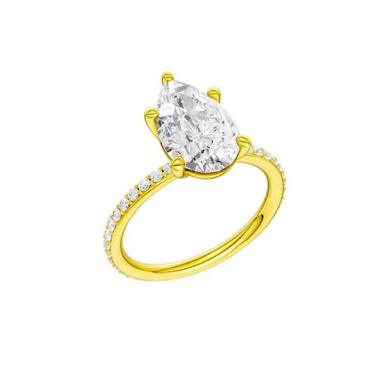 A three-quarter view of the Pear cut diamond engagement ring in 14k yellow gold with a prong diamond band and cathedral setting