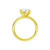 A profile view of the Pear cut diamond engagement ring in 14k yellow gold with a prong diamond band and cathedral setting