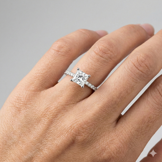 Princess cut diamond engagement ring in 14k white gold with a prong diamond band and cathedral setting on a hand