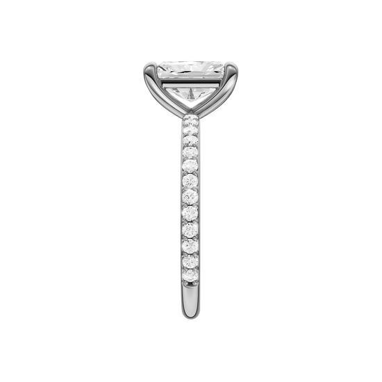 A side view of the radiant cut diamond engagement ring in platinum with a prong diamond band and cathedral setting