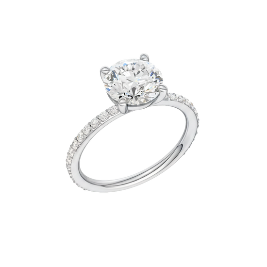 A three-quarter view of the Round cut diamond engagement ring in platinum with a prong diamond band and cathedral setting