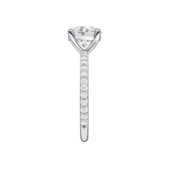 A side view of the Round cut diamond engagement ring in 14k white gold with a prong diamond band and cathedral setting