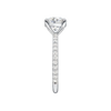 A side view of the Round cut diamond engagement ring in platinum with a prong diamond band and cathedral setting