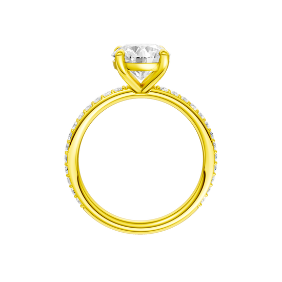 A profile view of the Round cut diamond engagement ring in 14k yellow gold with a prong diamond band and cathedral setting