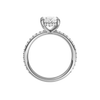 A profile view of the Oval cut diamond engagement ring in 14k white gold with a prong diamond band and cathedral setting