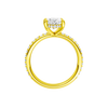 A profile view of the Oval cut diamond engagement ring in 14k yellow gold with a prong diamond band and cathedral setting