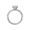 A profile view of the Pear cut diamond engagement ring in 14k white gold with a prong diamond band and cathedral setting