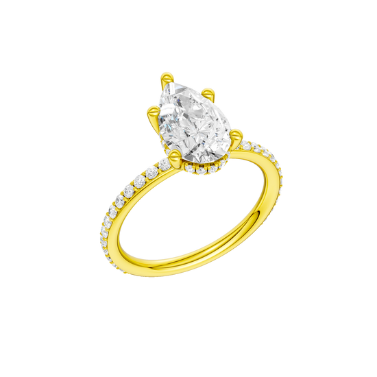 A three-quarter view of the Pear cut diamond engagement ring in 14k yellow gold with a prong diamond band and cathedral setting