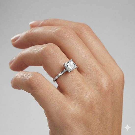 Princess cut diamond engagement ring in 14k white gold with a prong diamond band and cathedral setting on a hand