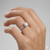 Princess cut diamond engagement ring in 14k white gold with a prong diamond band and cathedral setting on a hand