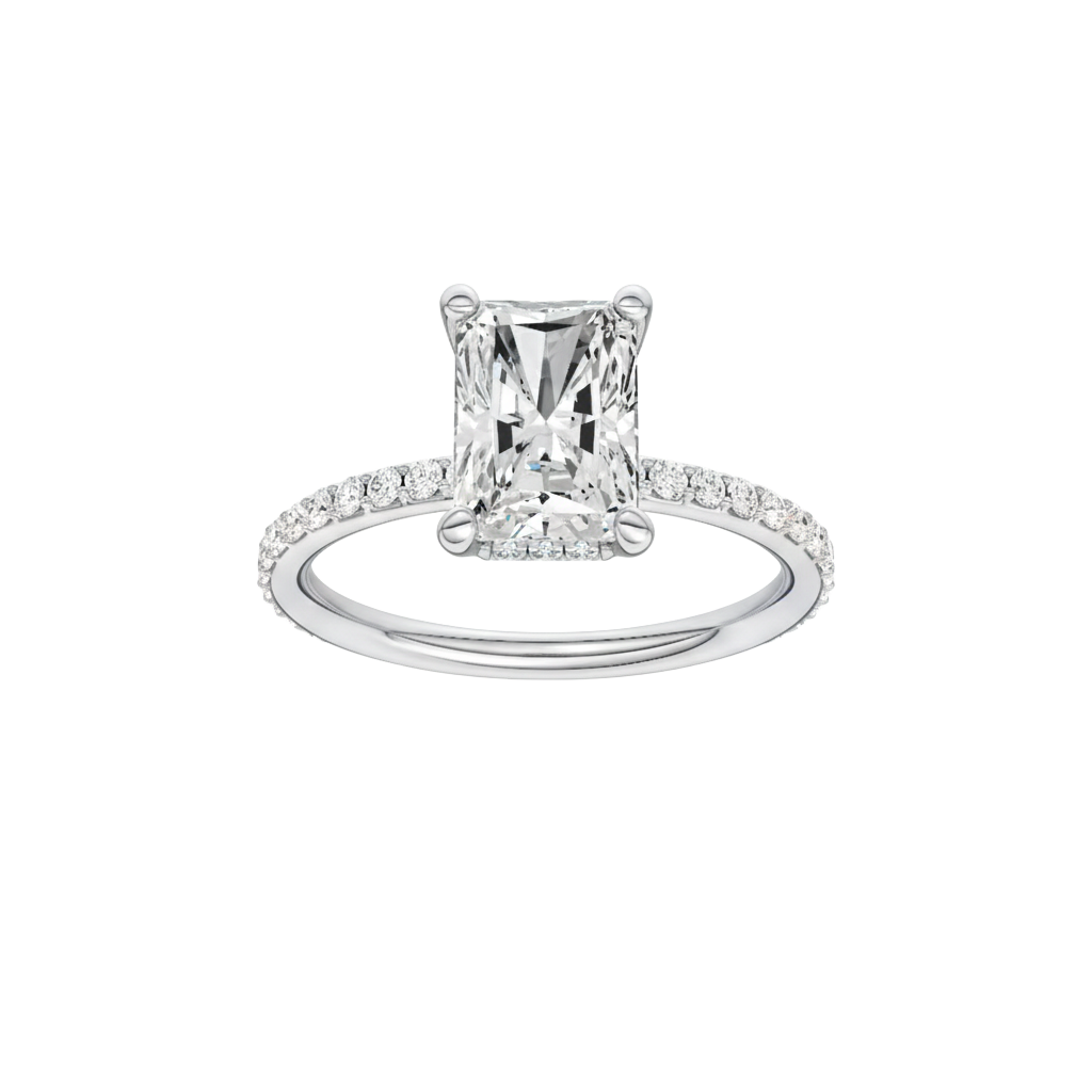 A front view of the Radiant cut diamond engagement ring in platinum with a diamond band and hidden halo, cathedral setting