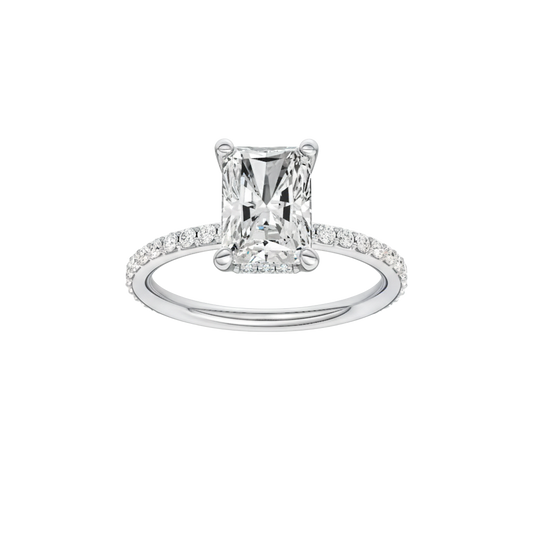 A front view of the Radiant cut diamond engagement ring in 14k white gold with a diamond band and hidden halo, cathedral setting