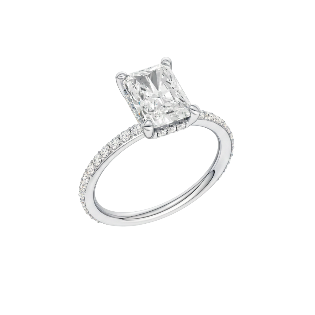 A three-quarter view of the Radiant cut diamond engagement ring in 14k white gold with a diamond band and hidden halo, cathedral setting