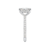 A side view of the Radiant cut diamond engagement ring in platinum with a diamond band and hidden halo, cathedral setting