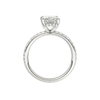 A profile view of the Radiant cut diamond engagement ring in 14k white gold with a diamond band and hidden halo, cathedral setting