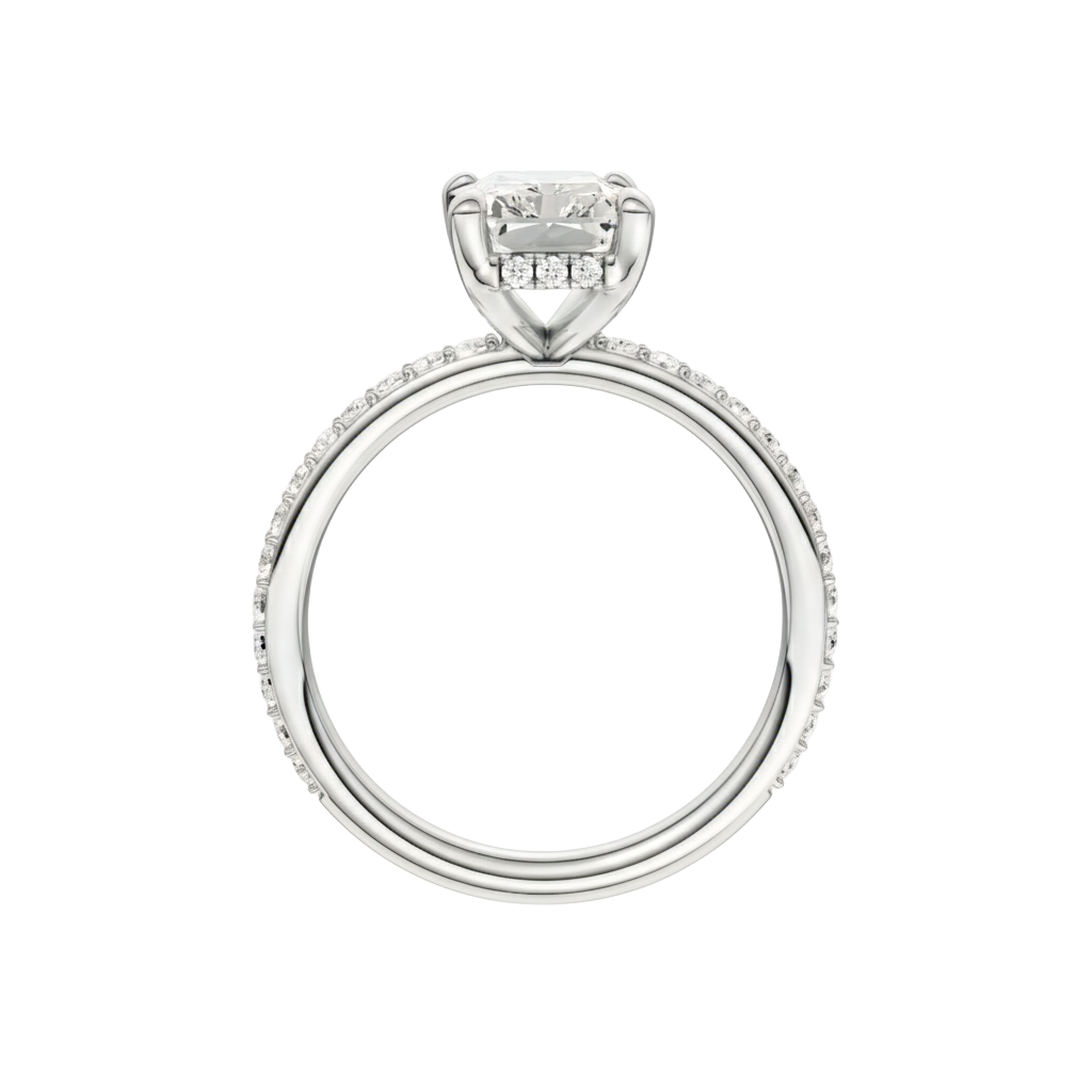 A profile view of the Radiant cut diamond engagement ring in 14k white gold with a diamond band and hidden halo, cathedral setting