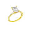 A three-quarter view of the Radiant cut diamond engagement ring in 14k yellow gold with a diamond band and hidden halo, cathedral setting