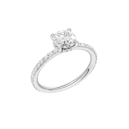 A three-quarter view of the Round cut diamond engagement ring in platinum with a prong diamond band and cathedral setting