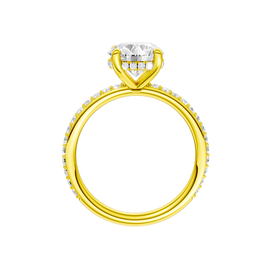 A profile view of the Round cut diamond engagement ring in 14k yellow gold with a prong diamond band and cathedral setting