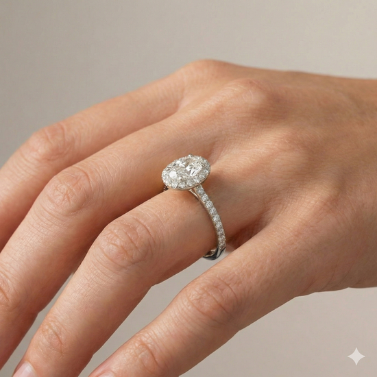 The Elongated Cushion cut diamond engagement ring in 14k white gold with a prong band and solitaire setting on a hand