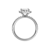 A profile view of the Emerald cut diamond engagement ring in 14k white gold with a prong diamond band and cathedral setting