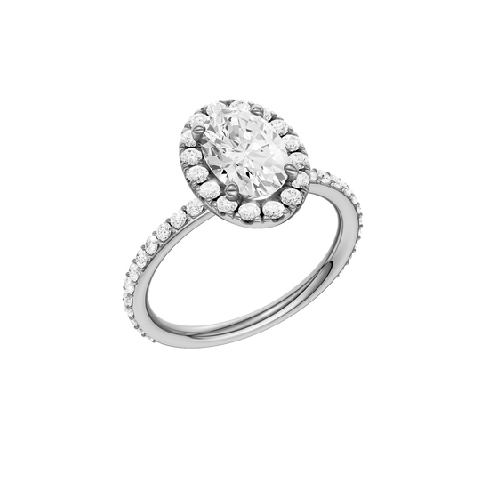 A three-quarter view of the Oval cut diamond engagement ring in 14k white gold with a prong diamond band and cathedral setting