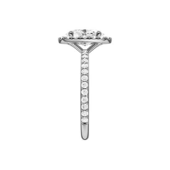 A side view of the Oval cut diamond engagement ring in 14k white gold with a prong diamond band and cathedral setting