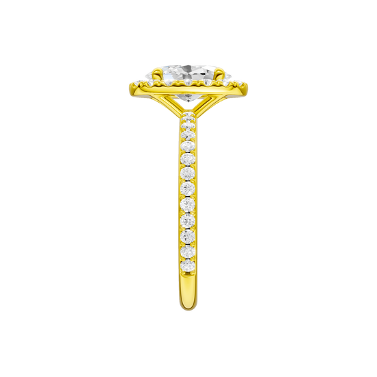 A side view of the Oval cut diamond engagement ring in 14k yellow gold with a prong diamond band and cathedral setting