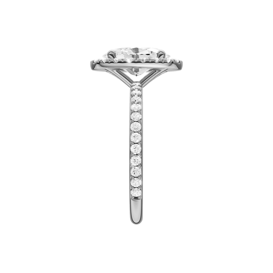 A side view of the Oval cut diamond engagement ring in platinum with a prong diamond band and cathedral setting