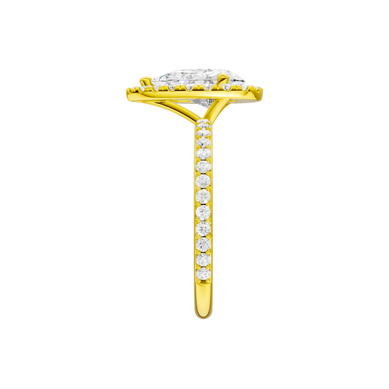 A side view of the Pear cut diamond engagement ring in 14k yellow gold with a prong diamond band and cathedral setting