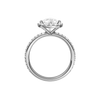 A profile view of the Pear cut diamond engagement ring in platinum with a prong diamond band and cathedral setting