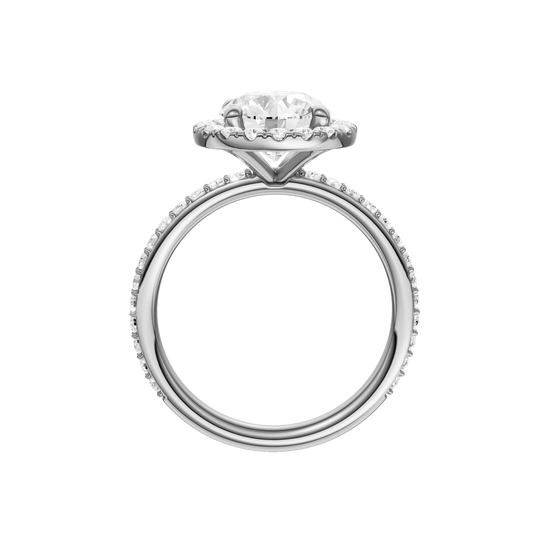 A profile view of the Round cut diamond engagement ring in platinum with a prong diamond band and cathedral setting