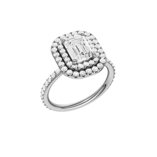 A three-quarter view of the Emerald cut diamond engagement ring in 14k white gold with a prong diamond band and cathedral setting