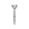 A side view of the Round cut diamond engagement ring in platinum with a diamond channel band and cathedral setting