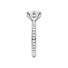 A side view of the Elongated Cushion cut diamond engagement ring in platinum with a channel band and hidden halo setting