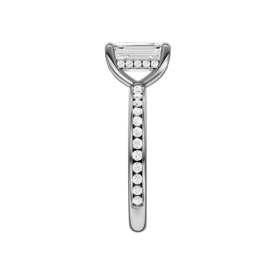 A side view of the Emerald cut diamond engagement ring in 14k white gold with a diamond channel band and cathedral setting