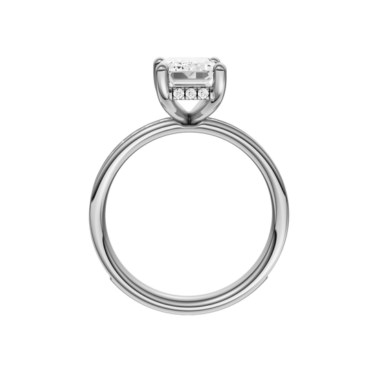 A profile view of the Emerald cut diamond engagement ring in 14k white gold with a diamond channel band and cathedral setting