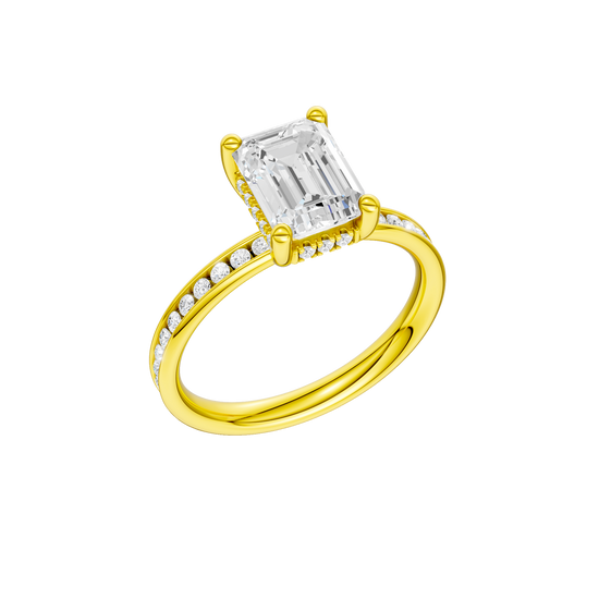 A three-quarter view of the Emerald cut diamond engagement ring in 14k yellow gold with a diamond channel band and cathedral setting