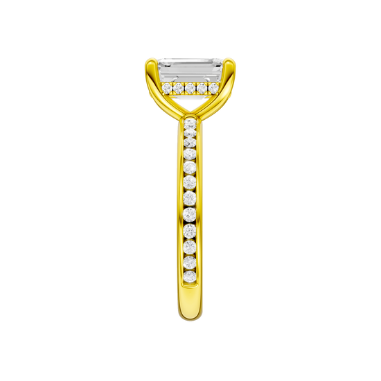 A side view of the Emerald cut diamond engagement ring in 14k yellow gold with a diamond channel band and cathedral setting