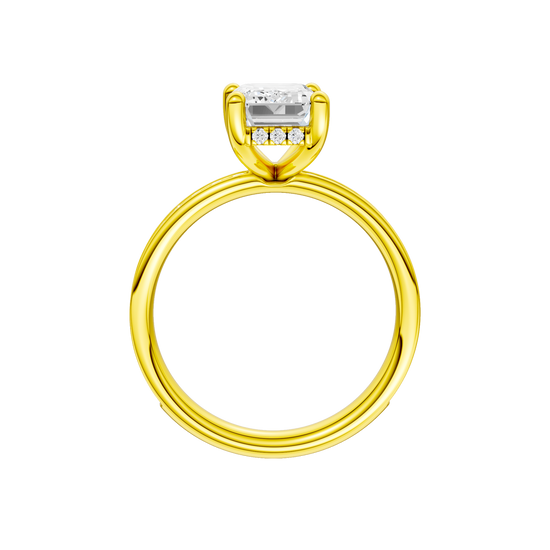 A profile view of the Emerald cut diamond engagement ring in 14k yellow gold with a diamond channel band and cathedral setting