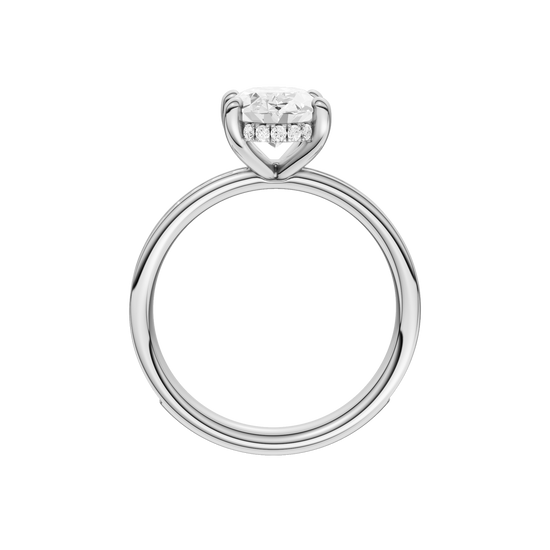 A profile view of the Oval cut diamond engagement ring in 14k white gold with a diamond channel band and cathedral setting