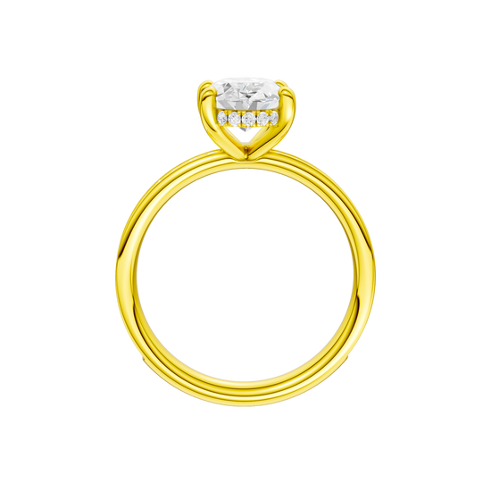 A profile view of the Oval cut diamond engagement ring in 14k yellow gold with a diamond channel band and cathedral setting