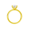 A profile view of the Pear cut diamond engagement ring in 14k yellow gold with a diamond channel band and cathedral setting