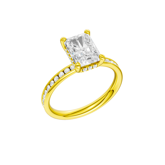 A three-quarter view of the Radiant cut diamond engagement ring in 14k yellow gold with a diamond channel band and cathedral setting