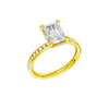 A three-quarter view of the Radiant cut diamond engagement ring in 14k yellow gold with a diamond channel band and cathedral setting