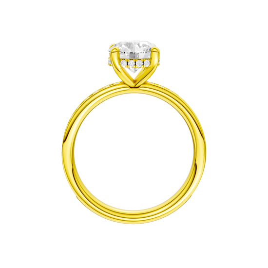 A profile view of the Round cut diamond engagement ring in 14k yellow gold with a diamond channel band and cathedral setting