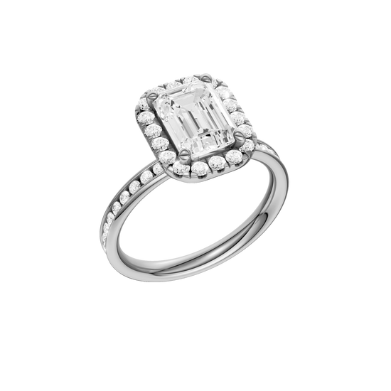 Platinum emerald cut halo engagement ring shown at an angled three quarter view highlighting the emerald center diamond, round halo and channel set band.