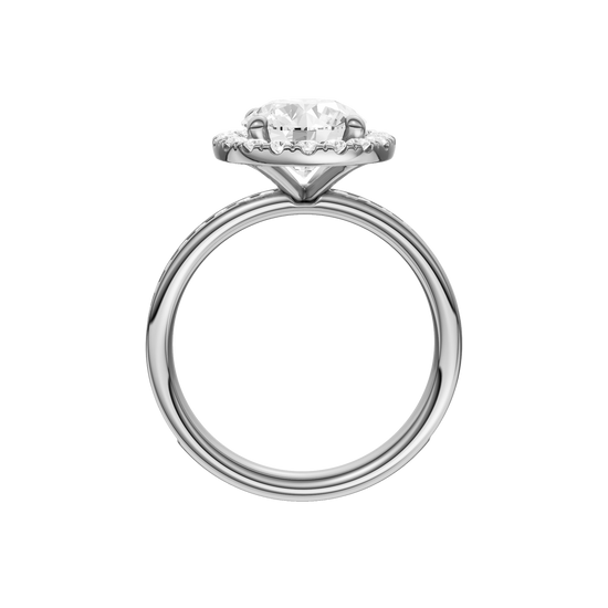 A profile view of the Round cut diamond engagement ring in platinum with a diamond channel band and halo setting